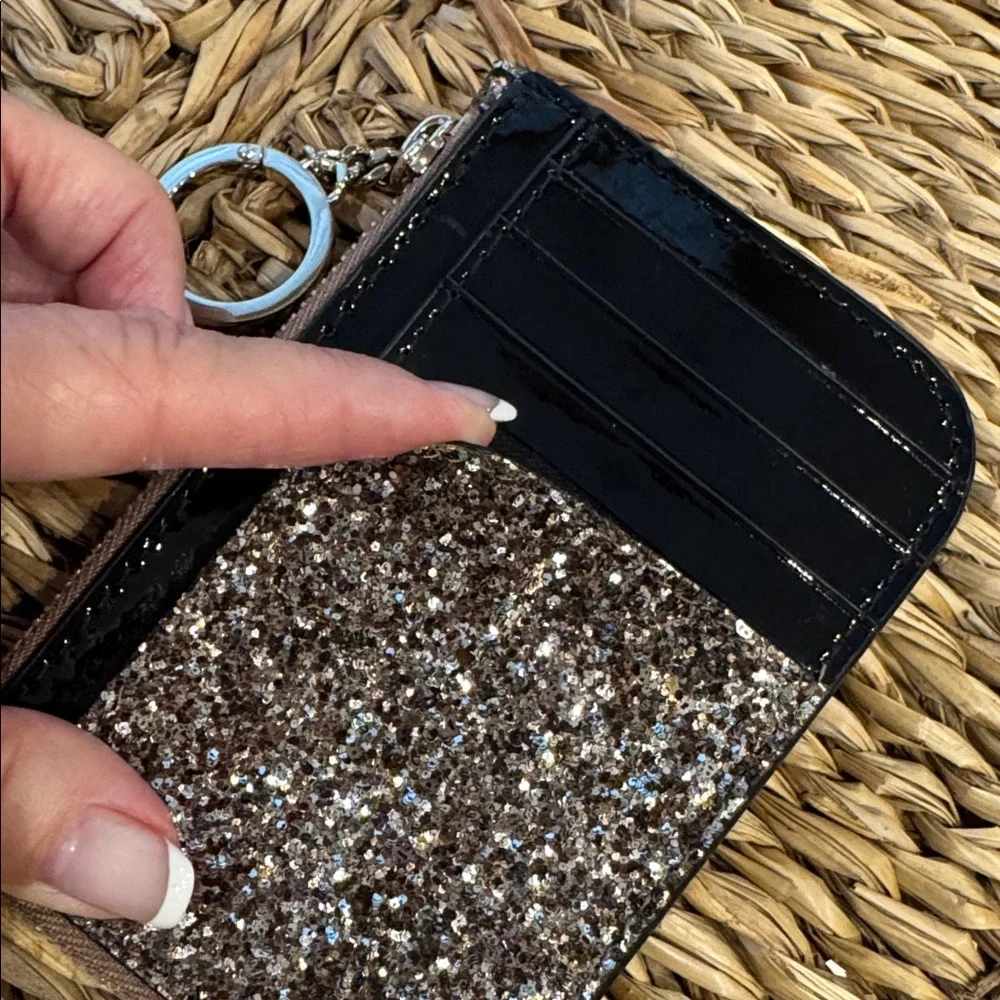 Kate Spade glitter clutch wristlet in gold and black